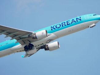 airborne commercial airplane against blue sky