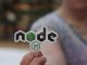 a person holing a sticker in close up photography